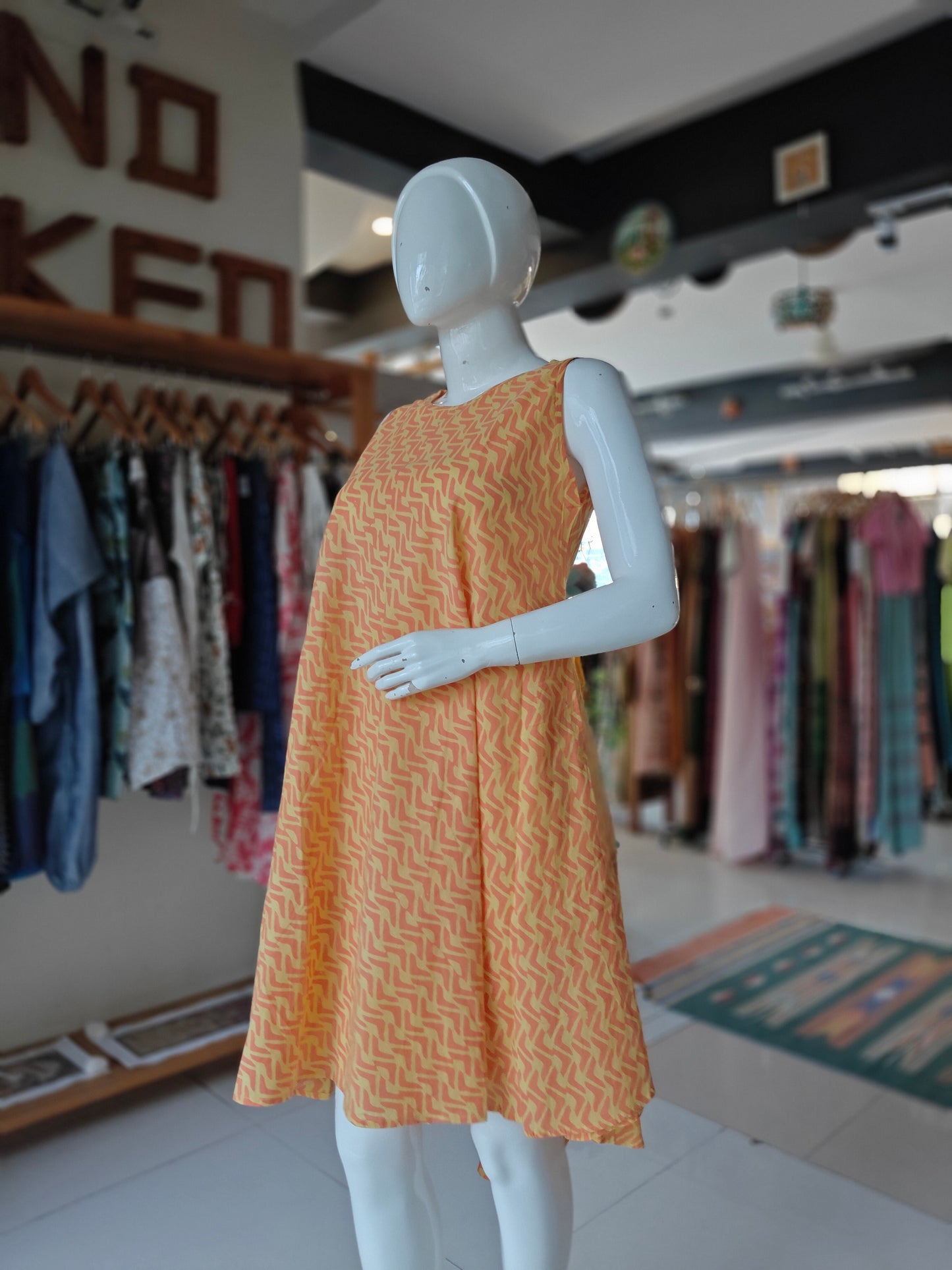 Orange and yellow sleeveless round neck flared dress