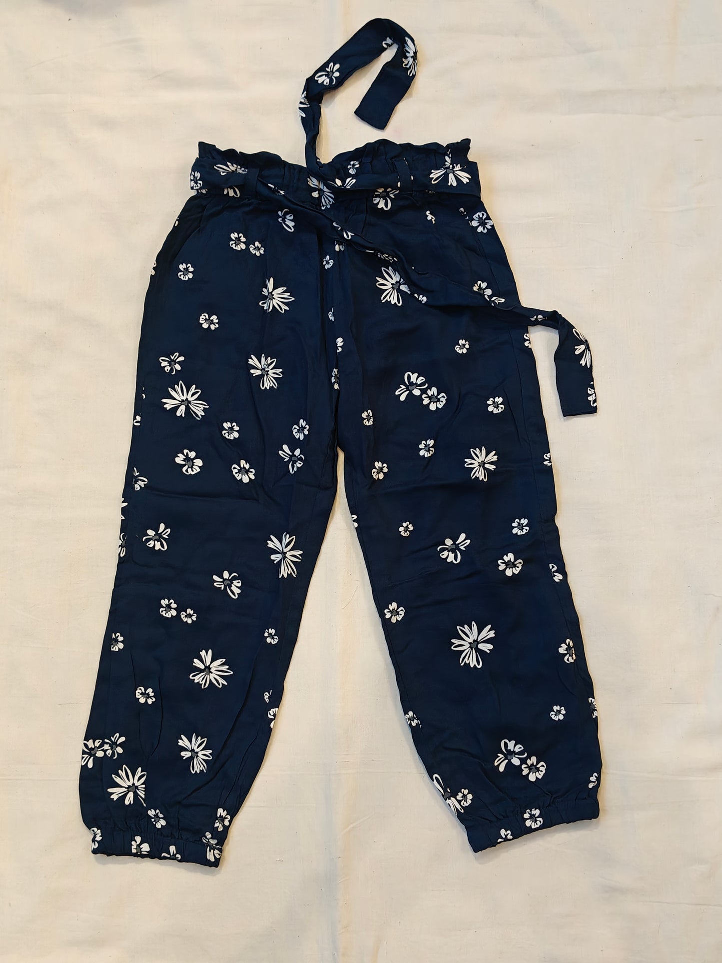 Rayon pants with floral prints and waist belt