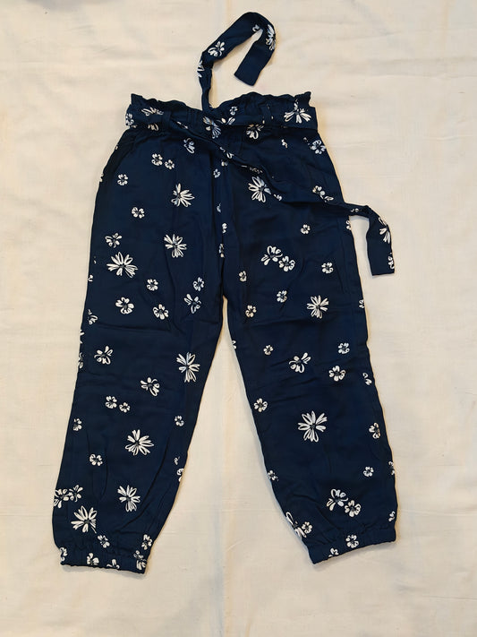 Rayon pants with floral prints and waist belt