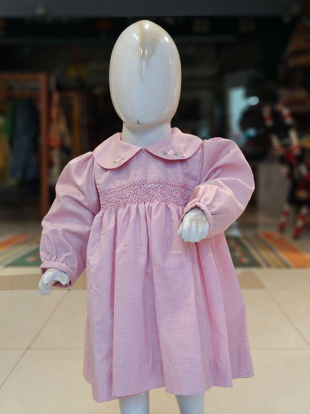 Checks smocking cotton frock for girls with embroidered Peter Pan collar and long sleeves