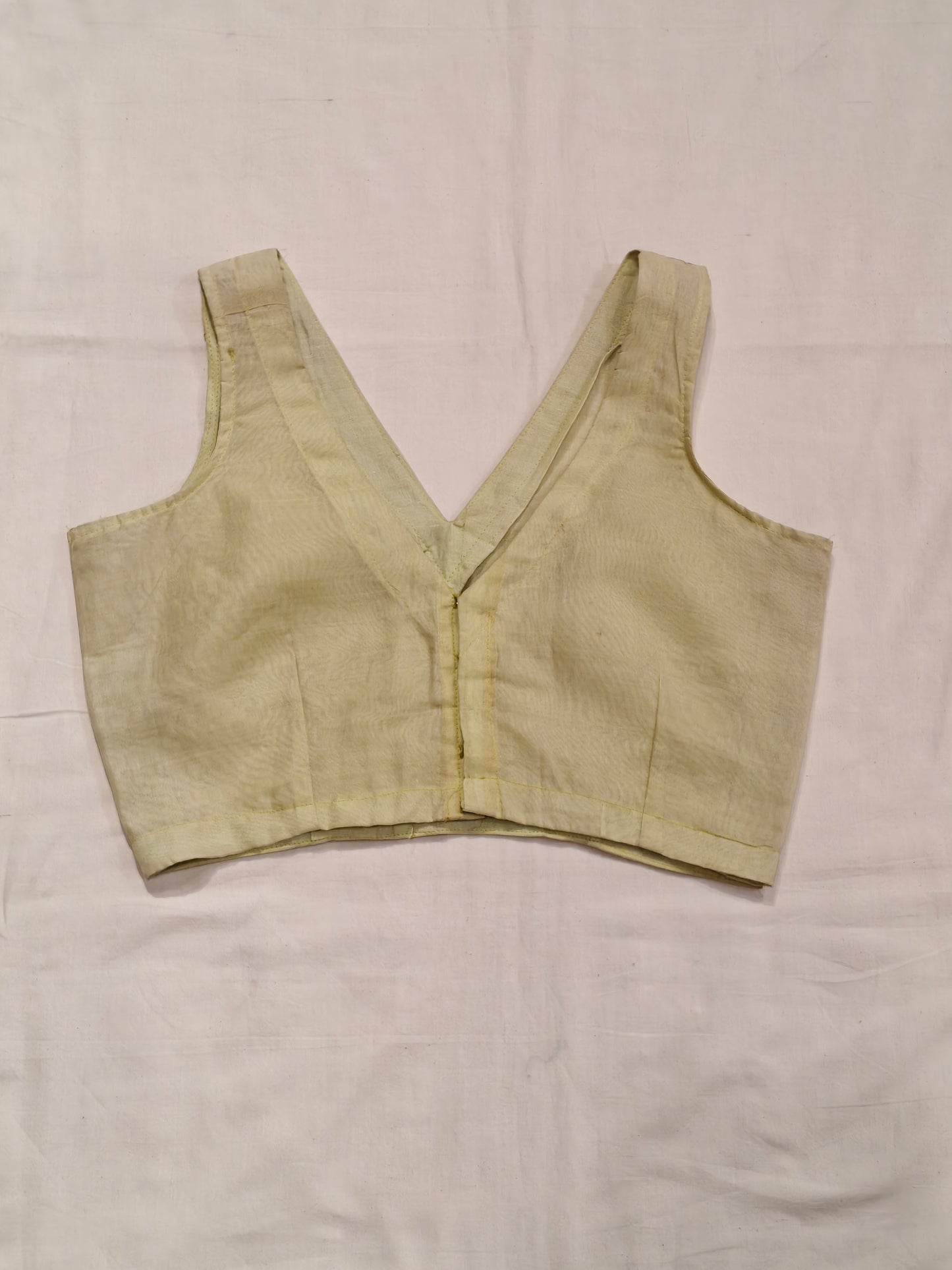 Pale yellow plain handloom silk sleeveless back-open blouse