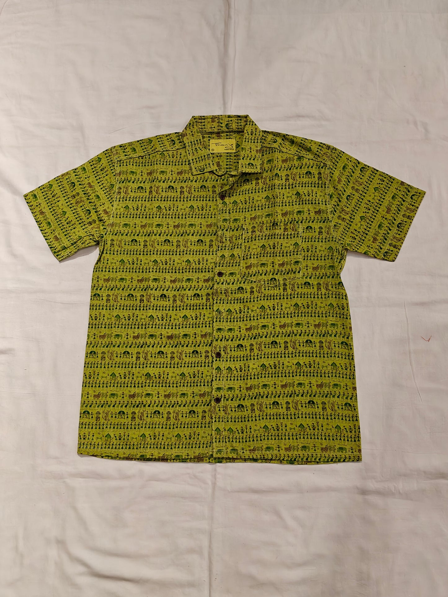 Green with Warli design printed short sleeved cotton men's shirt