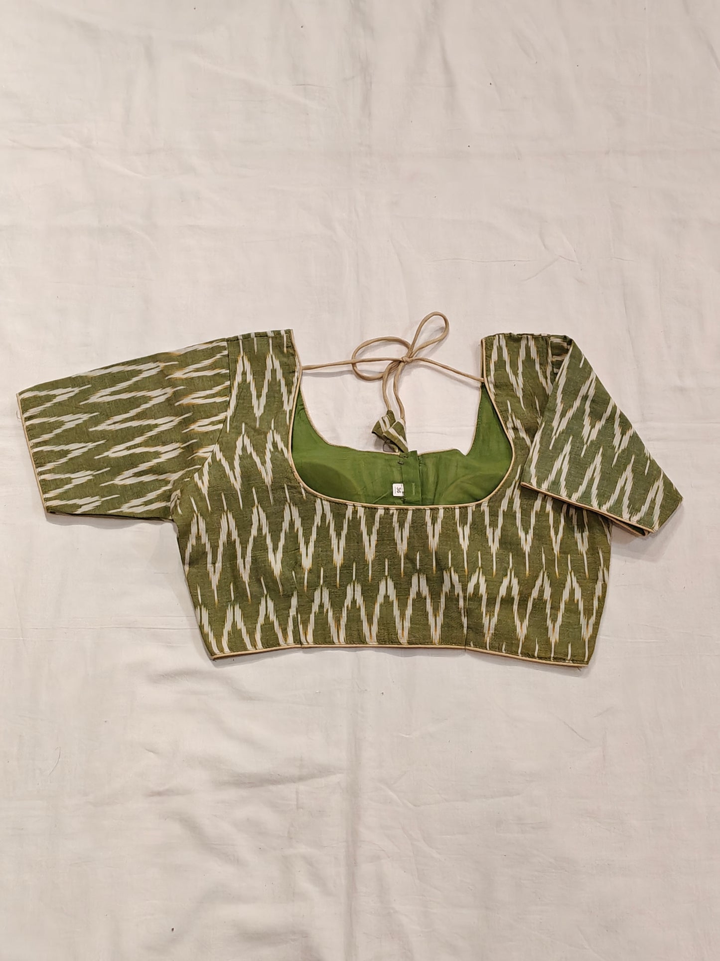 Mehndi green and cream ikat half sleeves padded cotton blouse