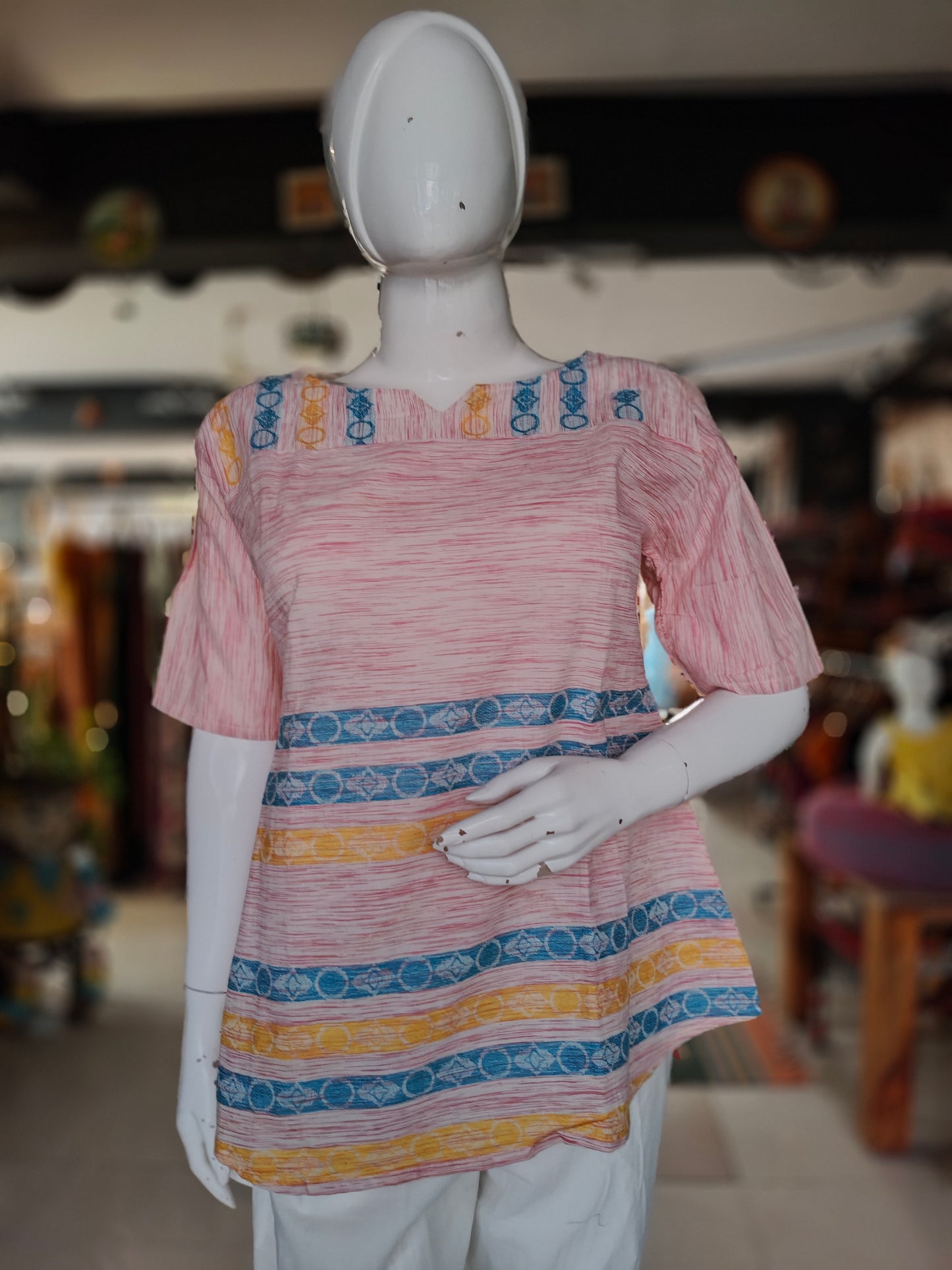 Pink handwoven cotton top with blue and yellow stripes