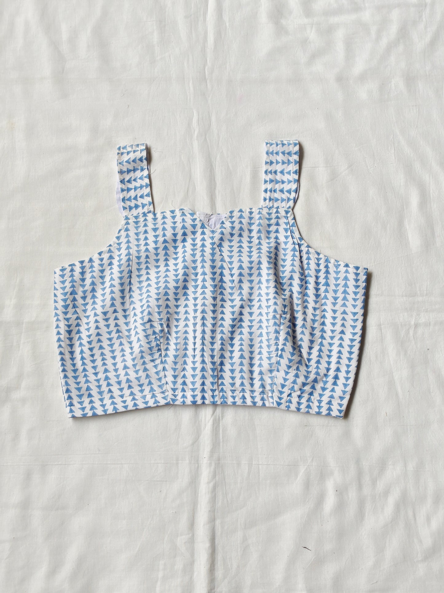 Blue triangles hand block printed on white base - sleeveless cotton blouse