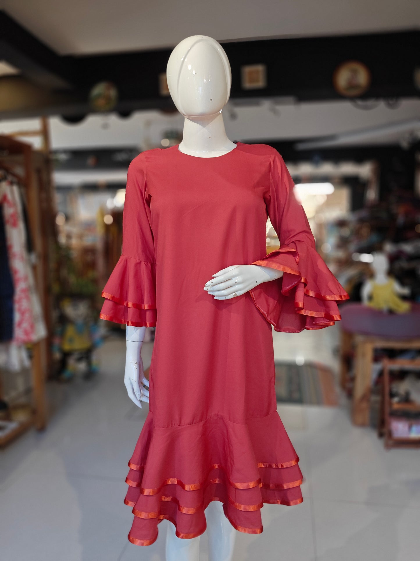 Red elbow sleeved dress with ruffled sleeves and hem ribbon trims