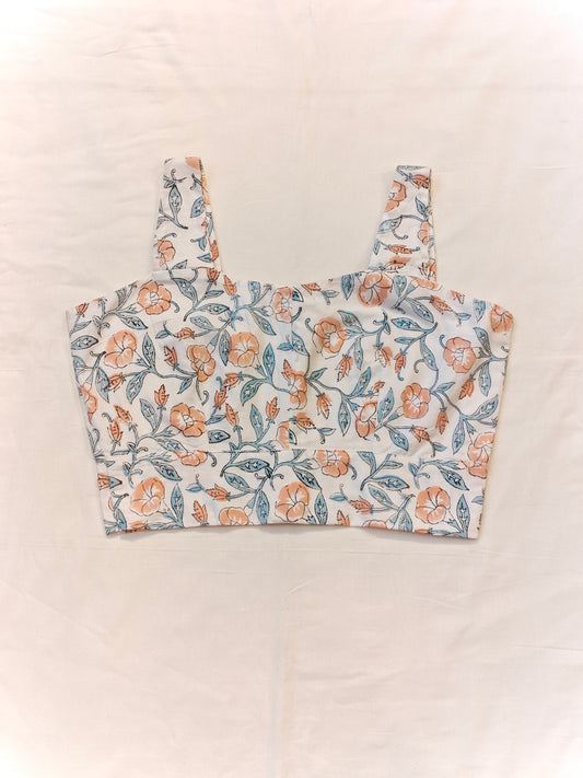 Orange floral prints on white base sleeveless blouse / crop top
