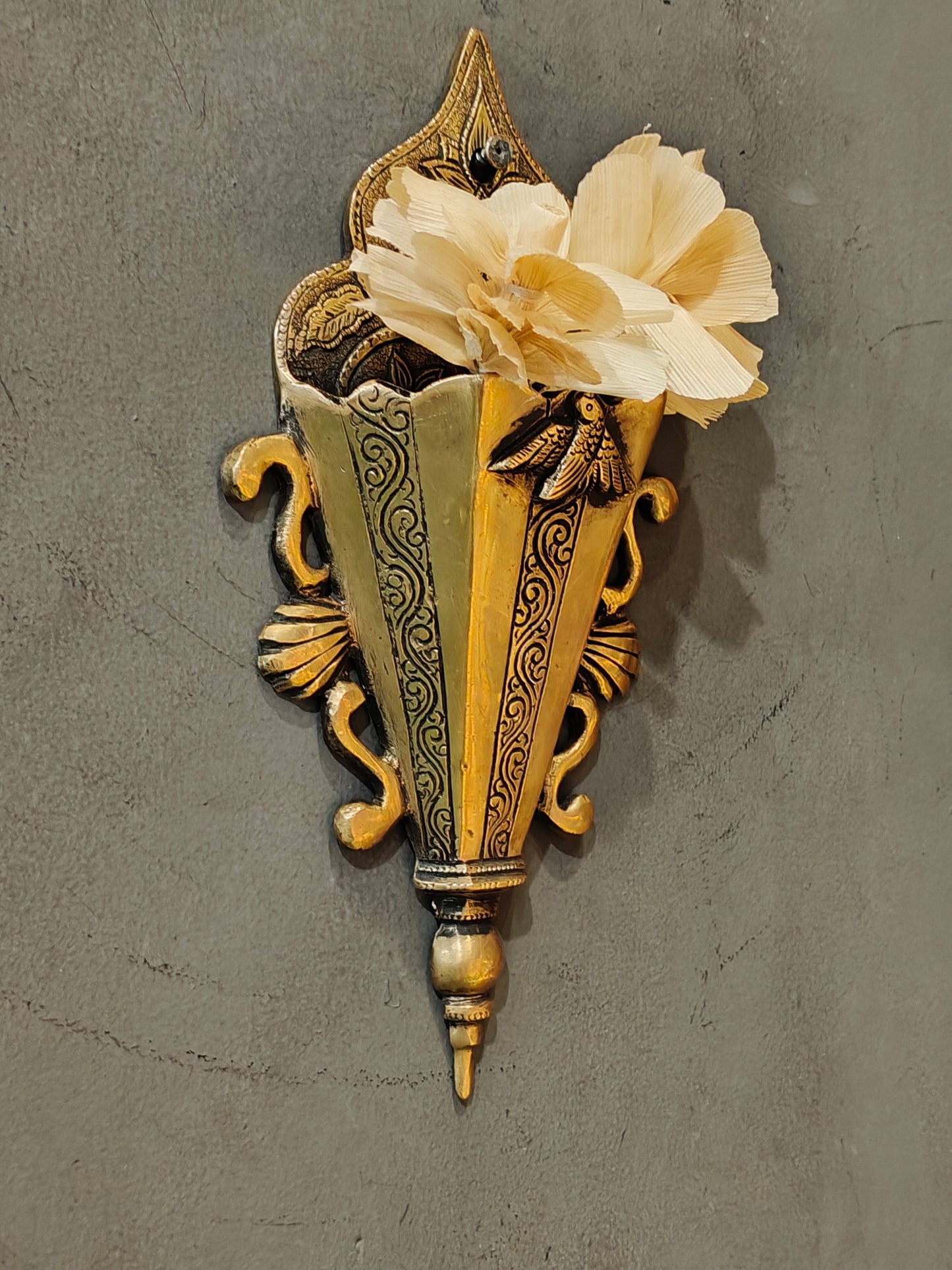 Brass wall pocket featuring intricate traditional engravings - wall decor cum organizer