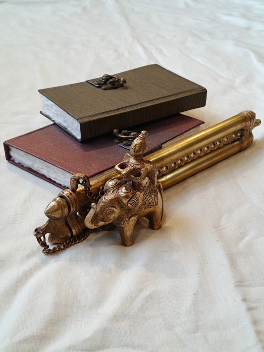 Vintage brass handcrafted ink pot with a person riding on an elephant design, double pen / quill holder with lock