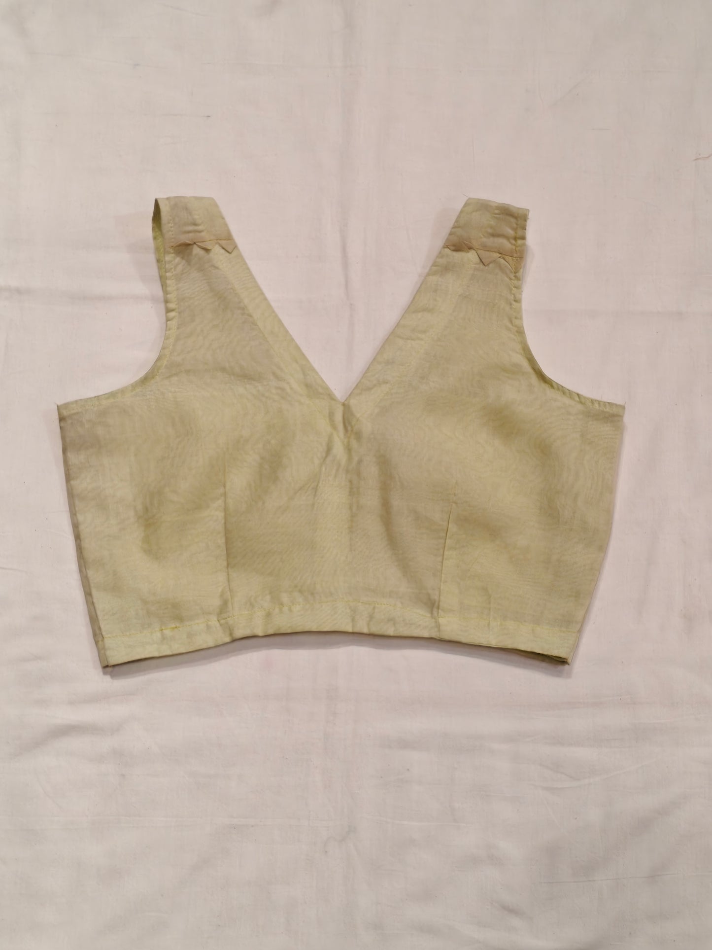 Pale yellow plain handloom silk sleeveless back-open blouse