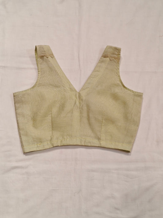 Pale yellow plain handloom silk sleeveless back-open blouse