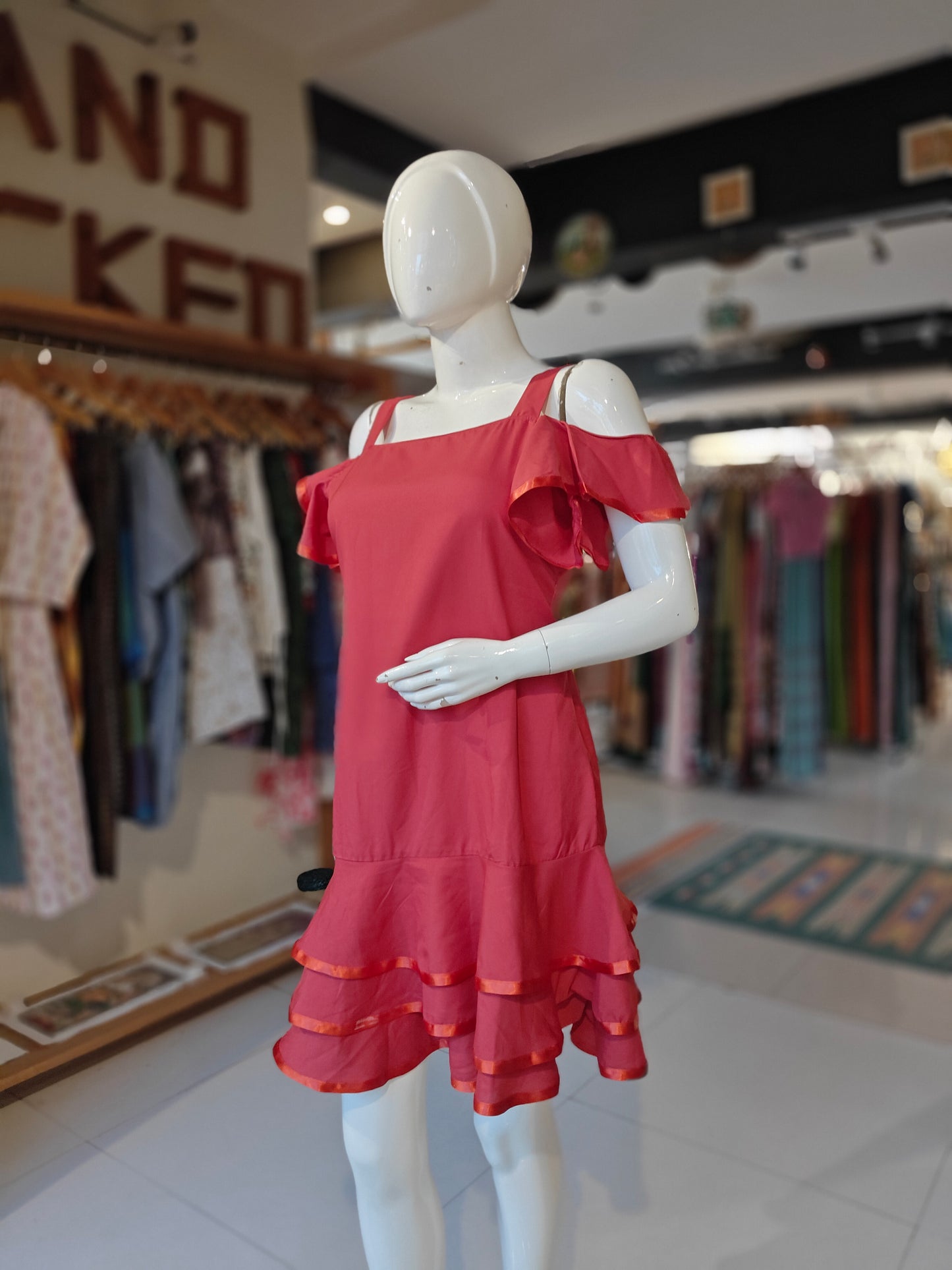 Red cold-shoulder dress with ruffled hem ribbon trims