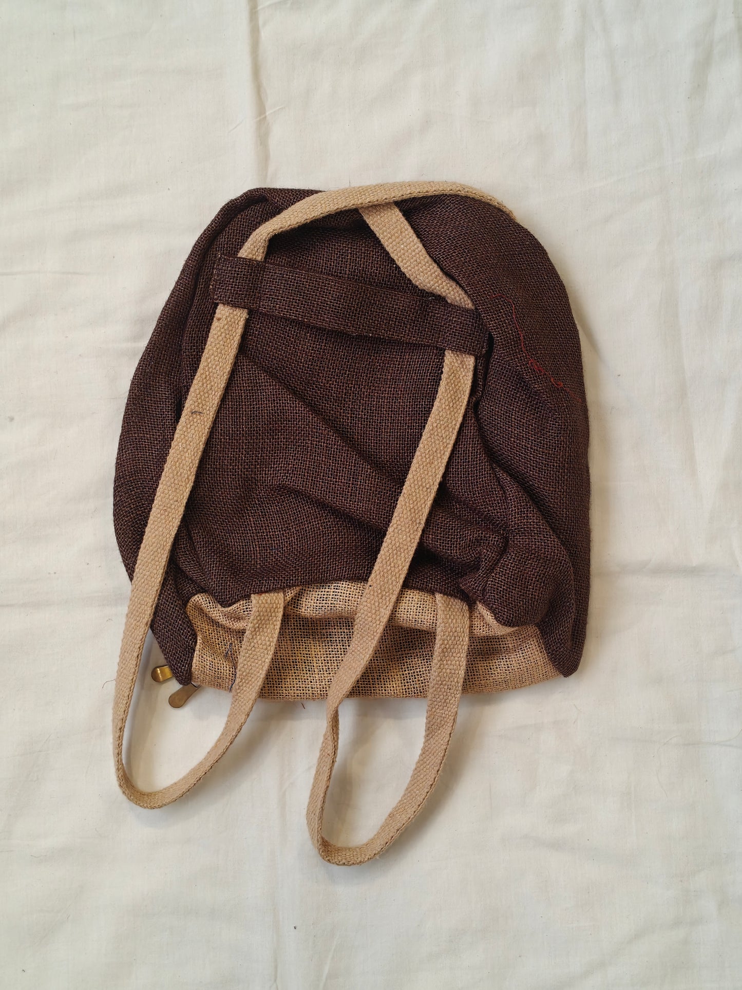 Day back pack cum handbag in jute with fabric panel
