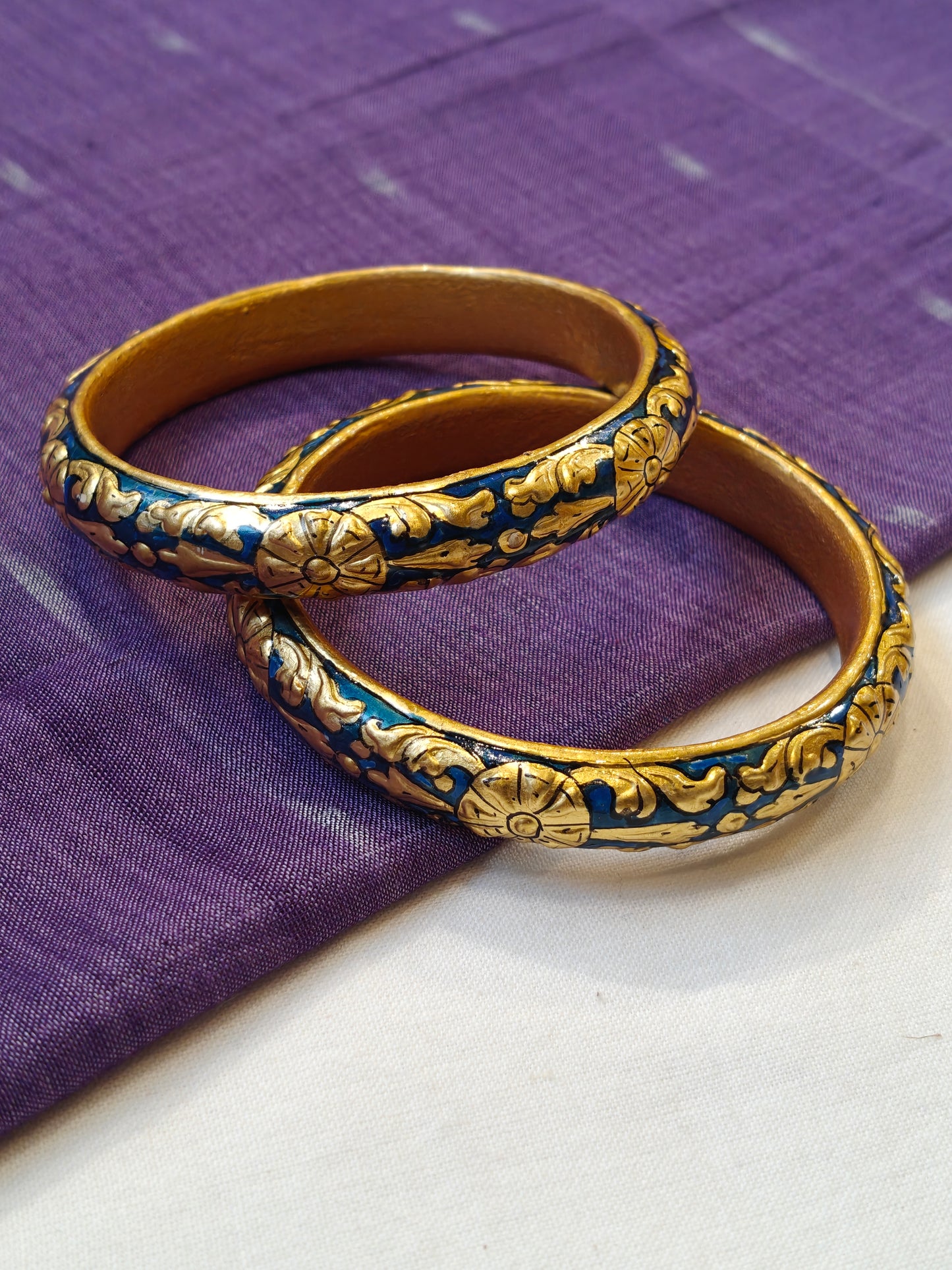 Blue gold leaf embossed pair of bangles with floral design - set of 2