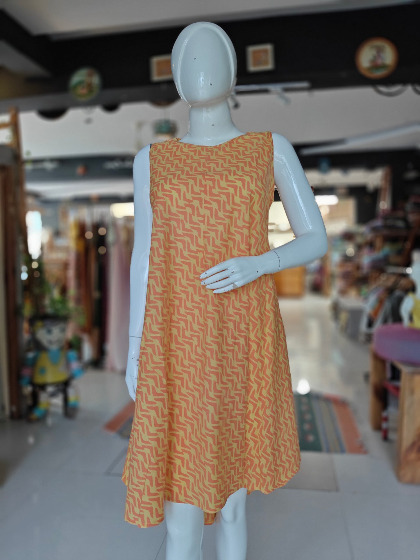 Orange and yellow sleeveless round neck flared dress