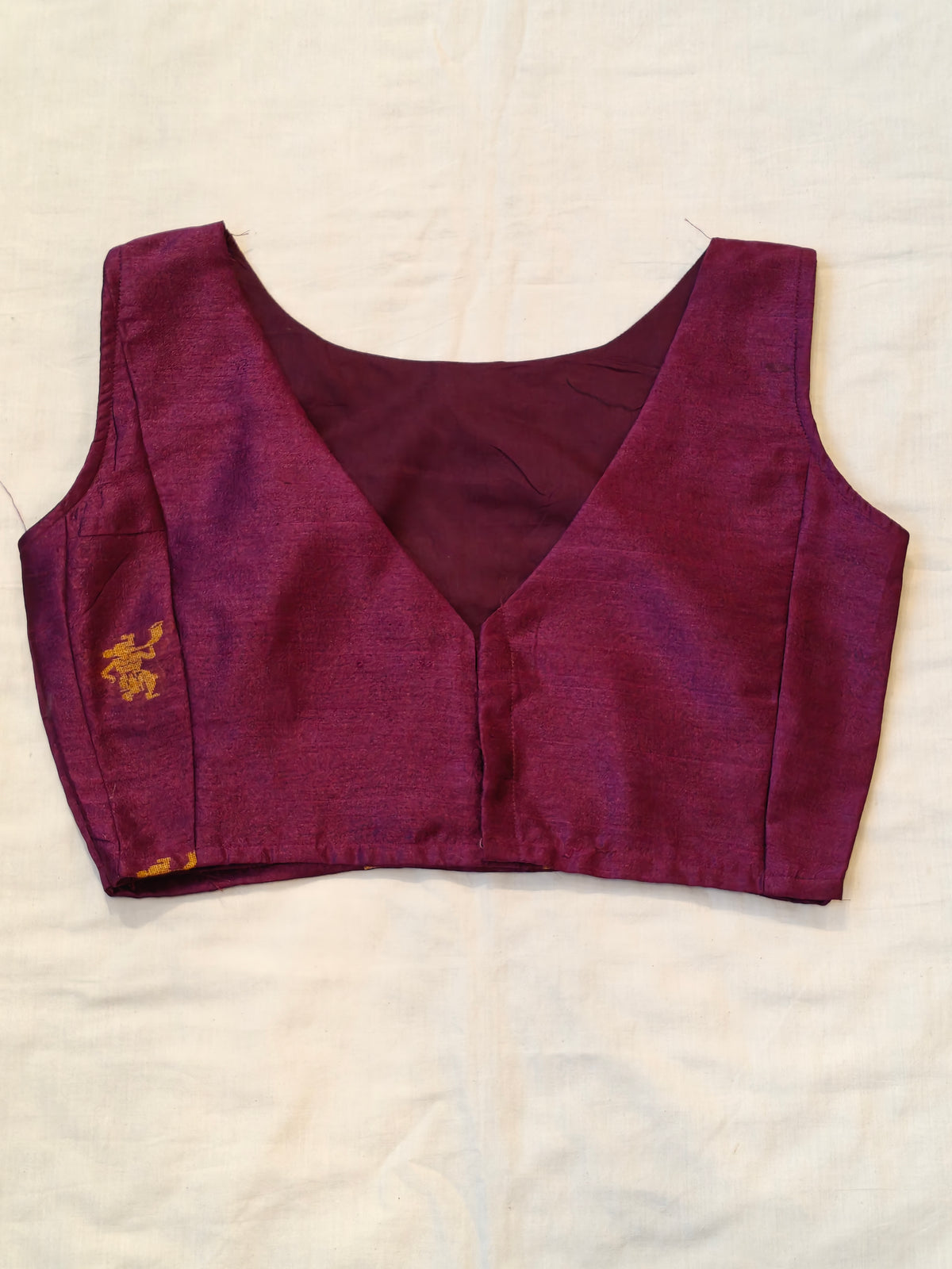 Purple handwoven raw silk sleeveless blouse with golden village motifs