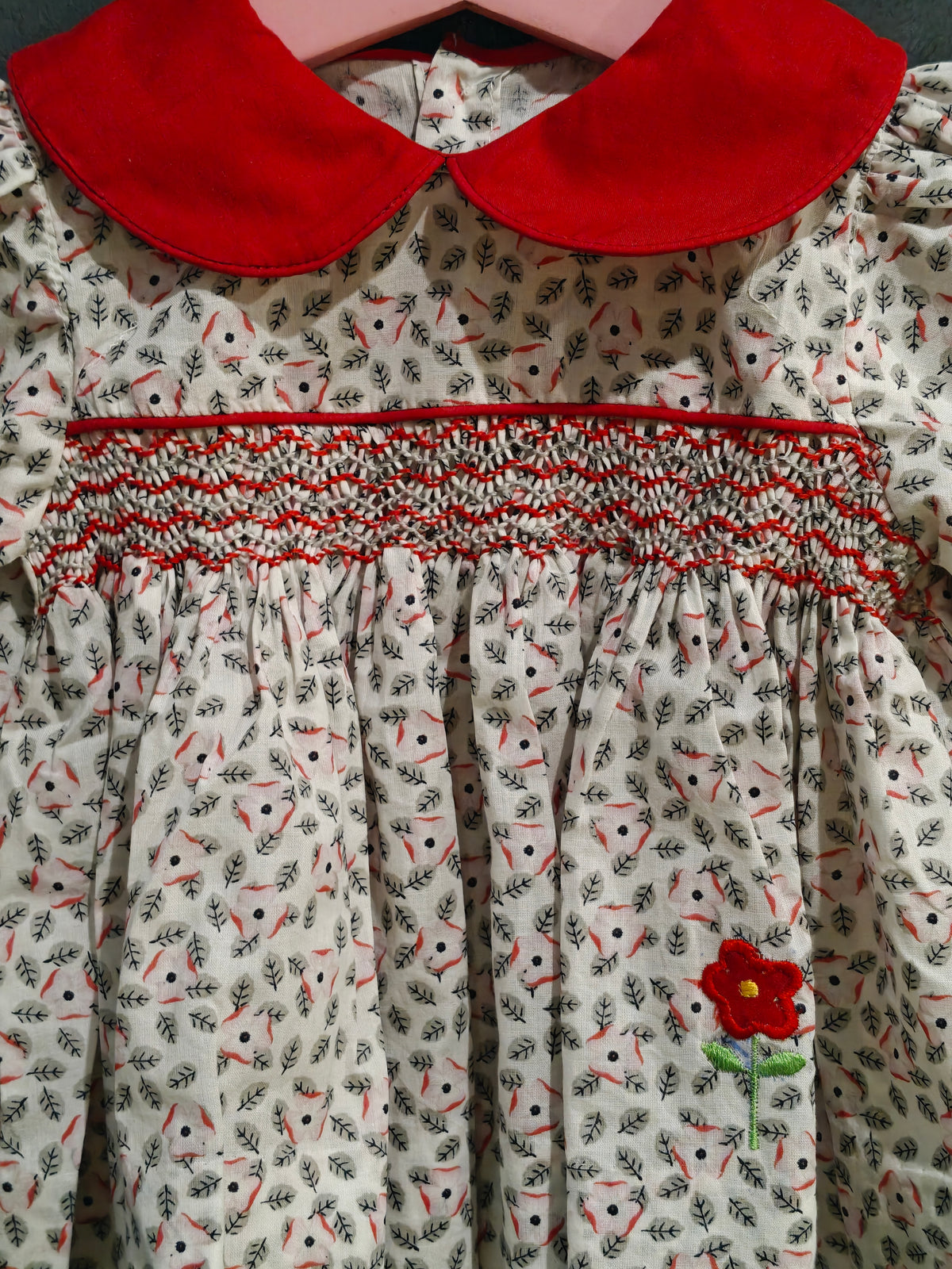 White n grey floral printed smocking frock with red peter pan collar