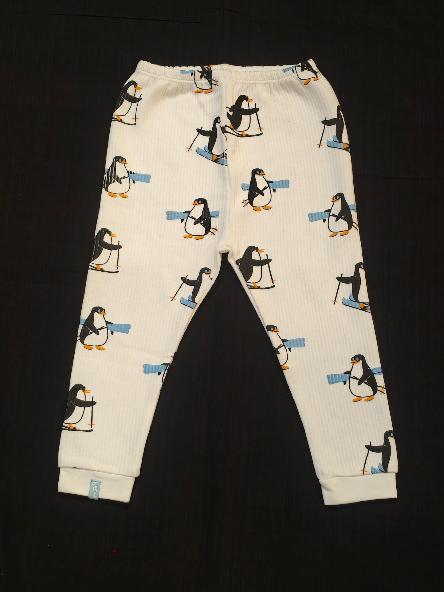 White thermal pants for kids with penguin prints