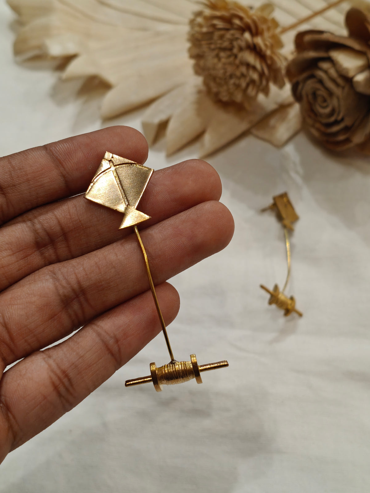Kite and spool shaped brass earrings