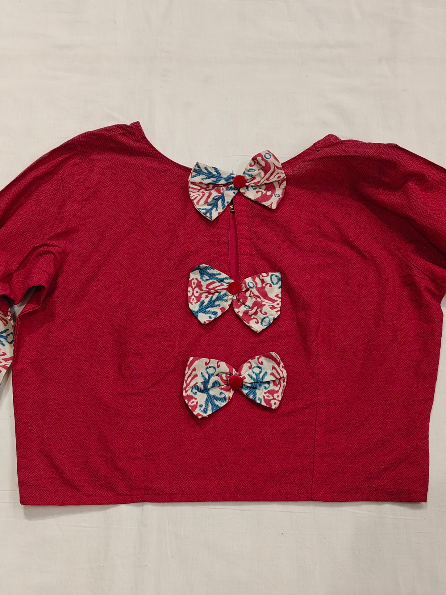 Pink printed flared sleeves cotton blouse with bows