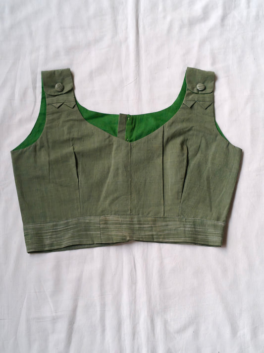 Green sleeveless handloom cotton blouse with buttons detailing