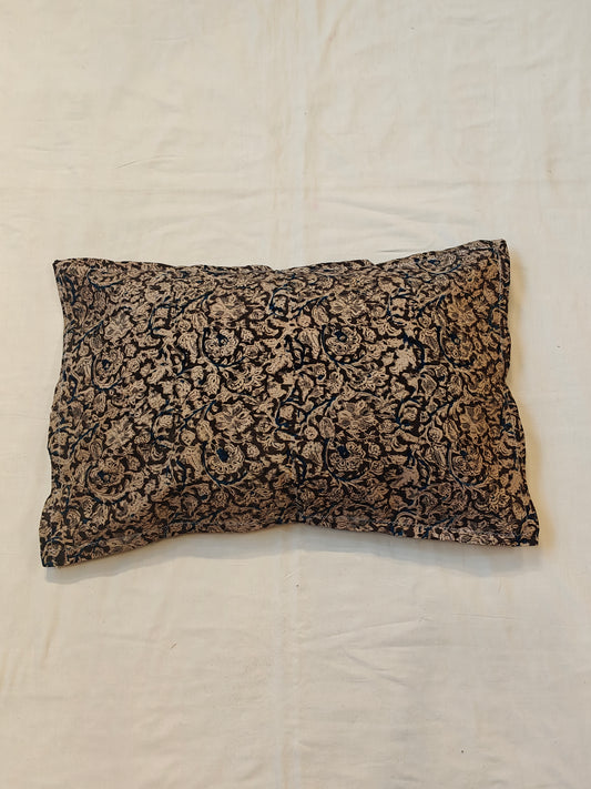Handcrafted pillow cover featuring floral Kalamkari patterns