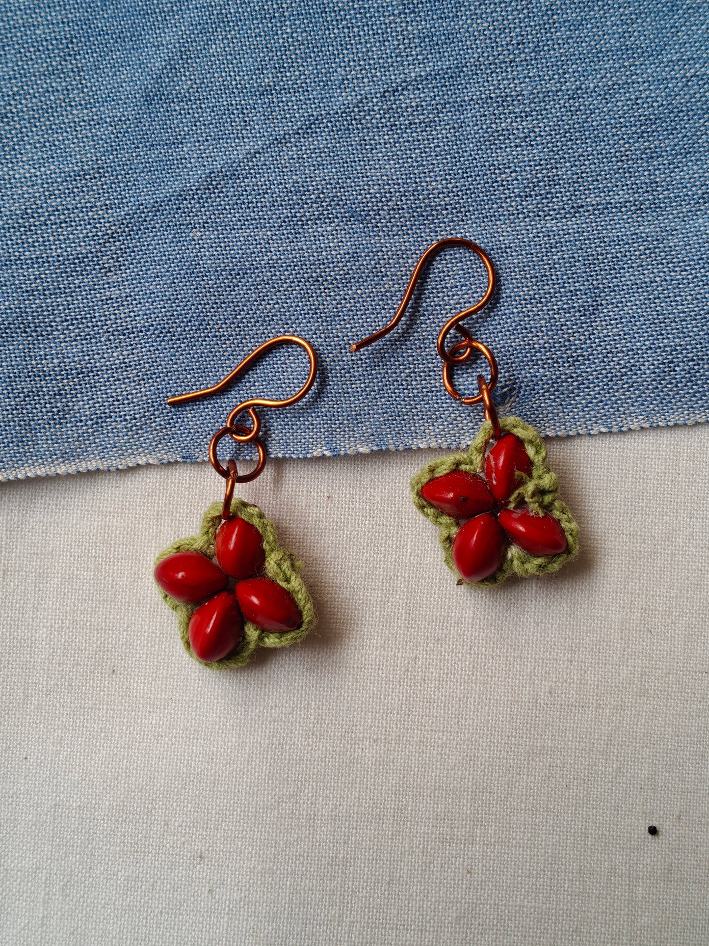 Handcrafted earrings with seeds and crochet flowers