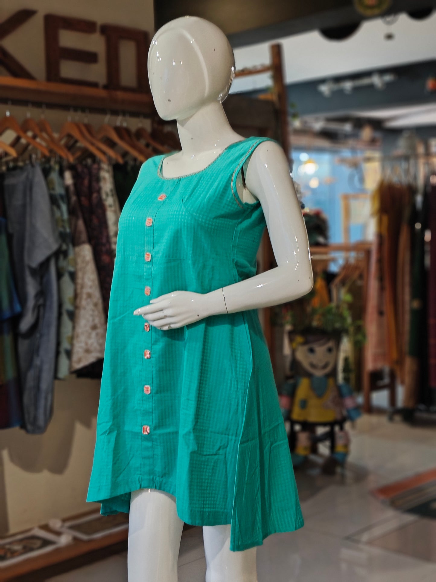 Teal green sleeveless cotton dress with embroidery on neckline n sleeves cap