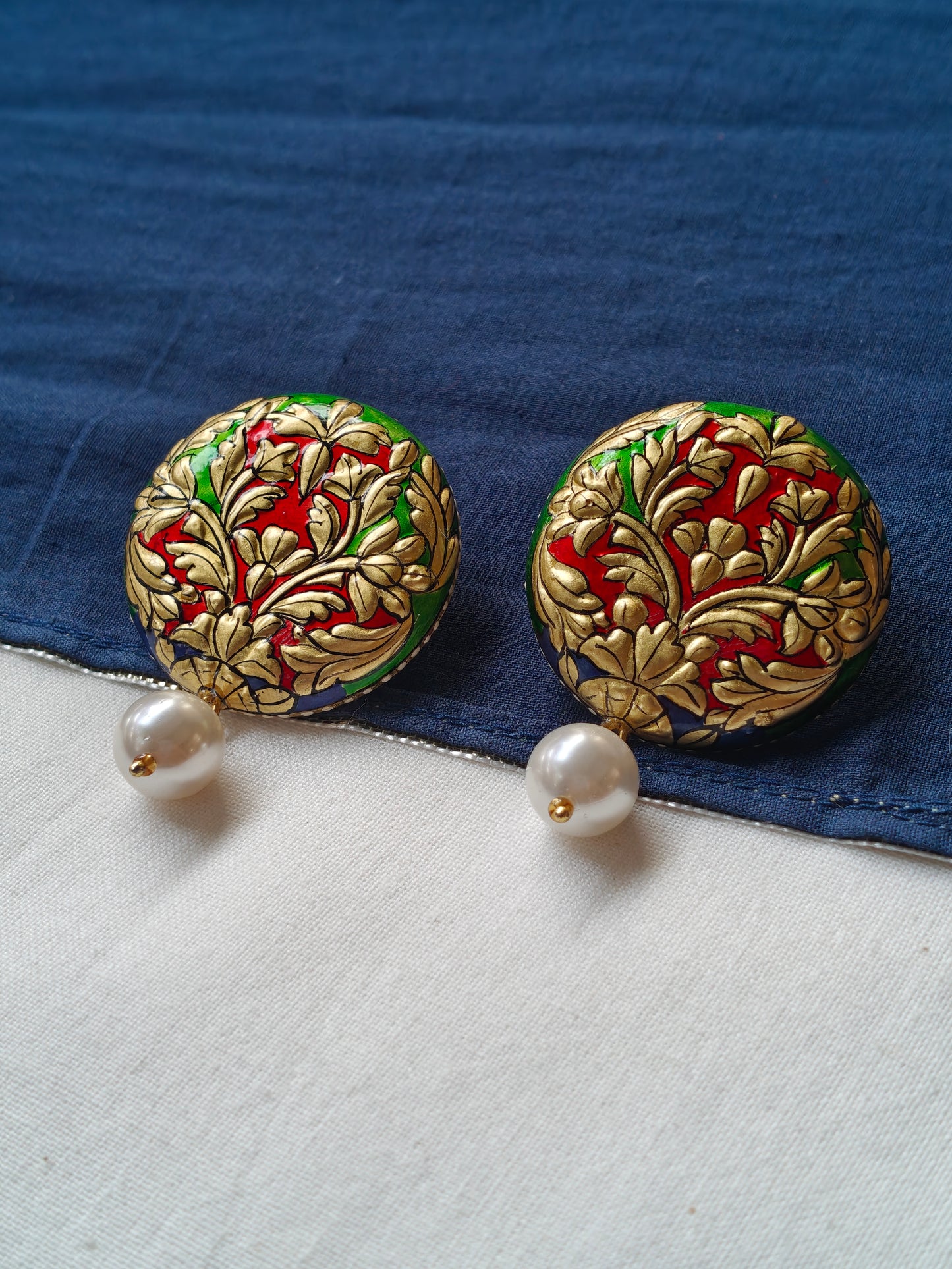 Gold embossed round with pearl stud earrings