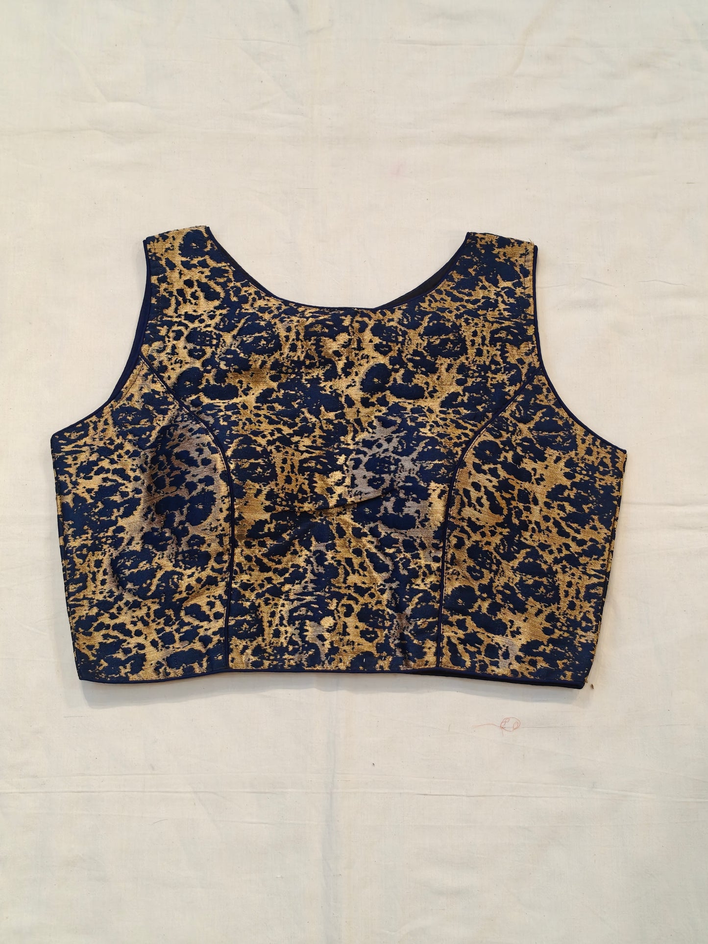 Blue and golden sleeveless blouse