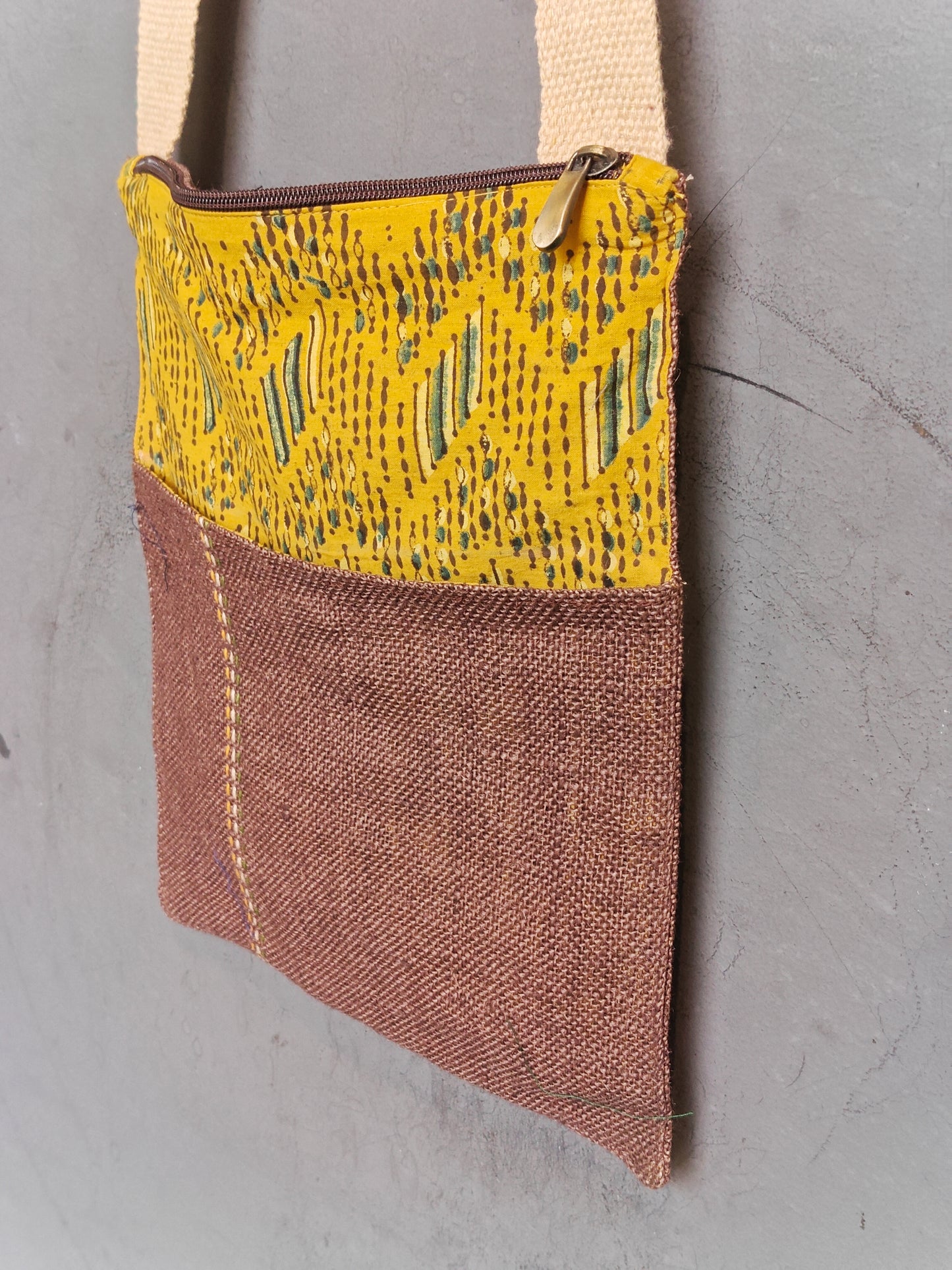 Handmade crossbody sling bag with multicolour fabric panels and jute