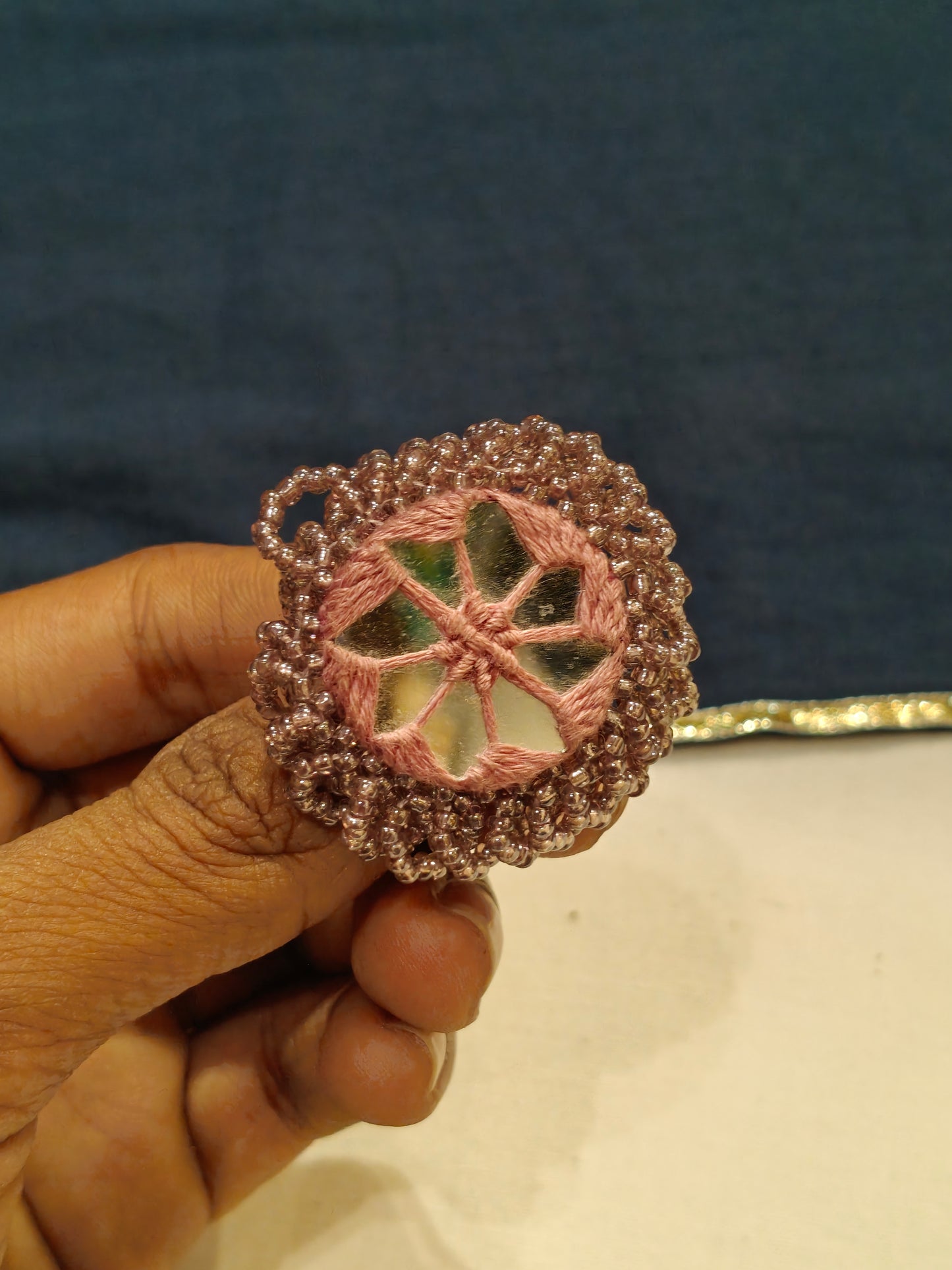 Handcrafted finger ring with bead work and mirror