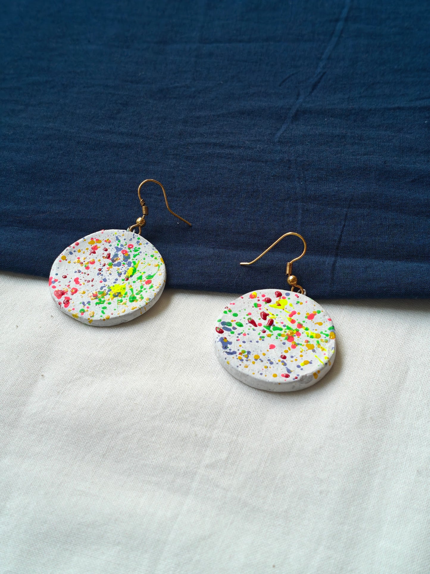 Round color splattered handcrafted, handpainted terracotta hook earrings