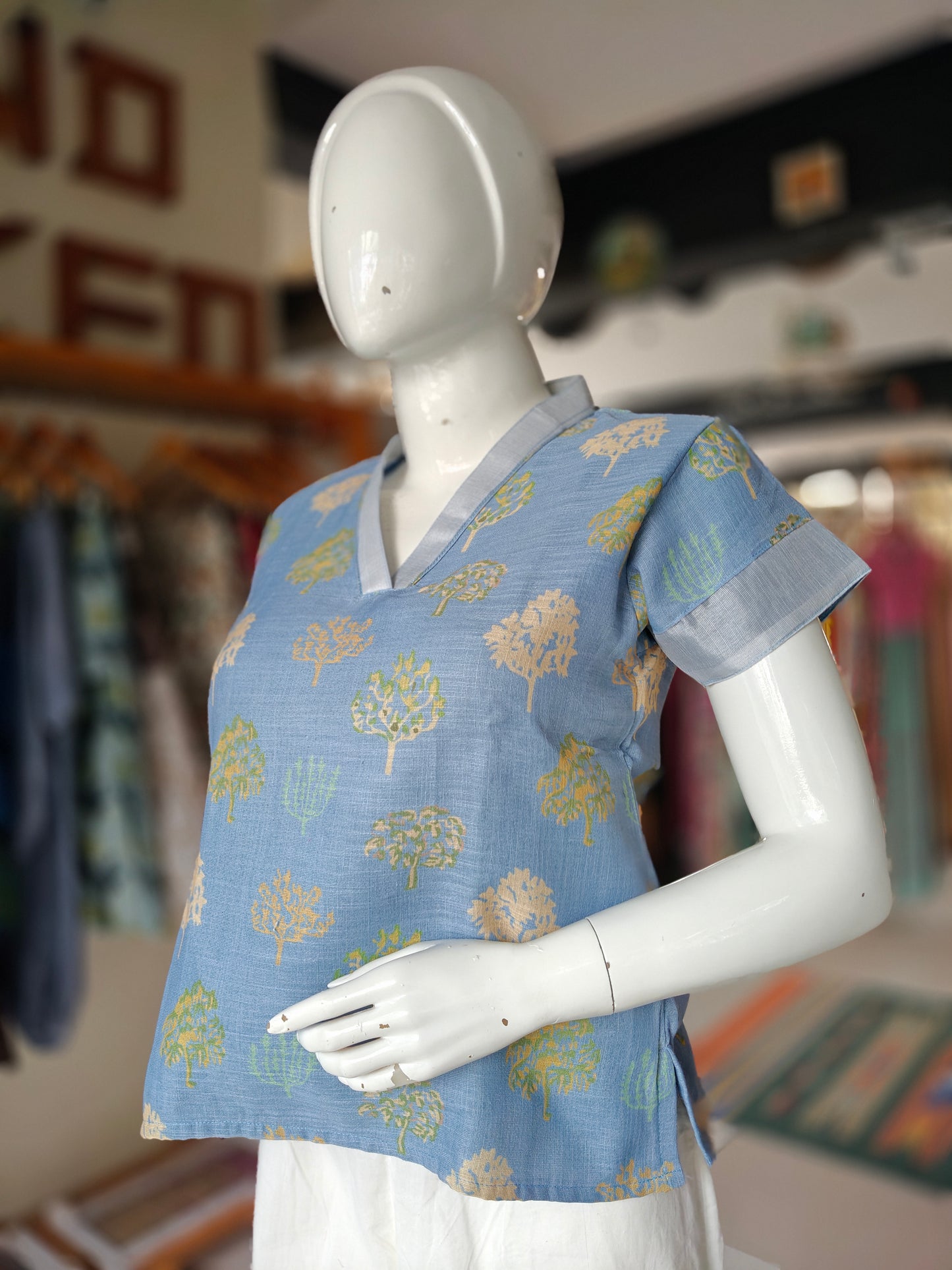 Blue trees linen printed top with grey neckline and sleeves