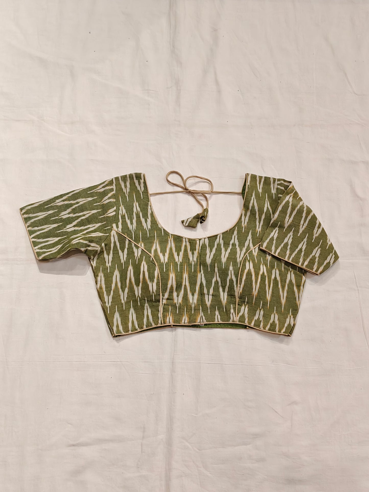 Mehndi green and cream ikat half sleeves padded cotton blouse