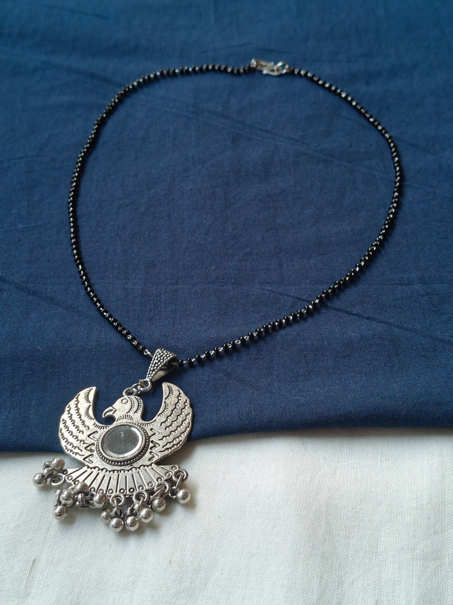 Falcon shaped oxidised silver look pendant black beads necklace