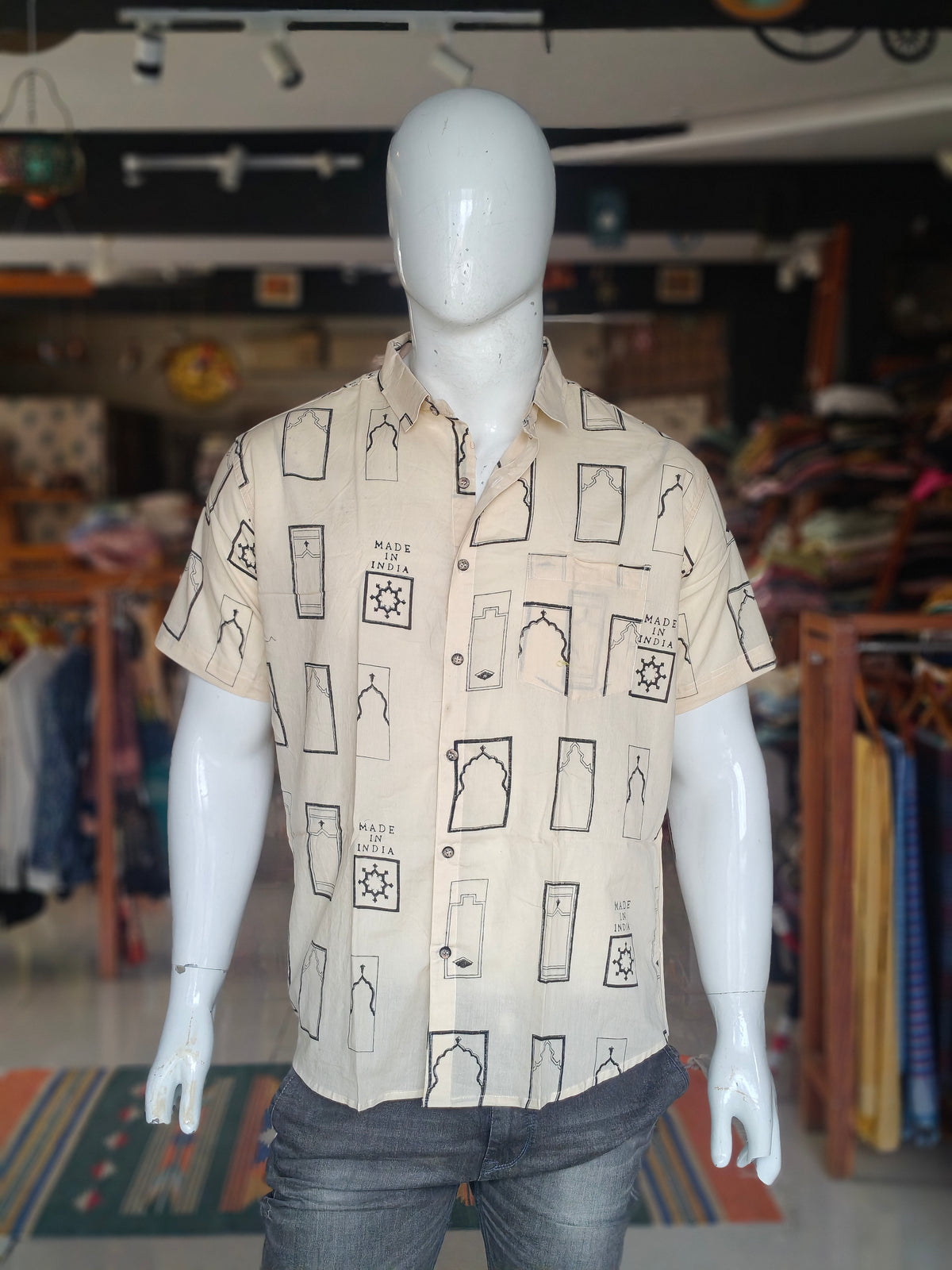 Off-white casual short sleeved shirt with architectural motifs and "Made in India" hand block prints