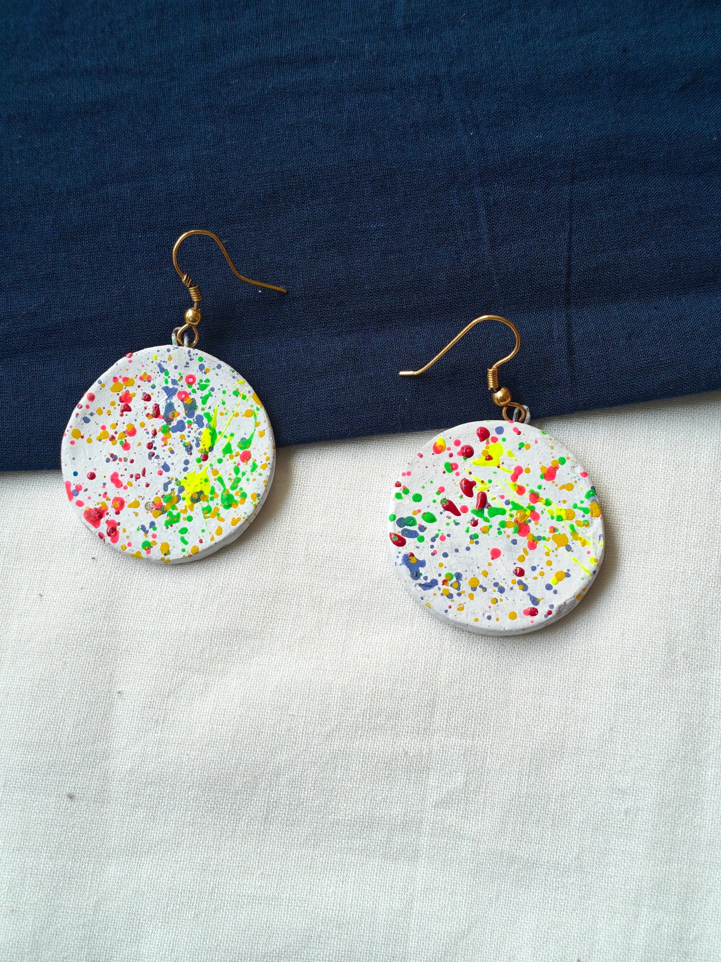 Round color splattered handcrafted, handpainted terracotta hook earrings