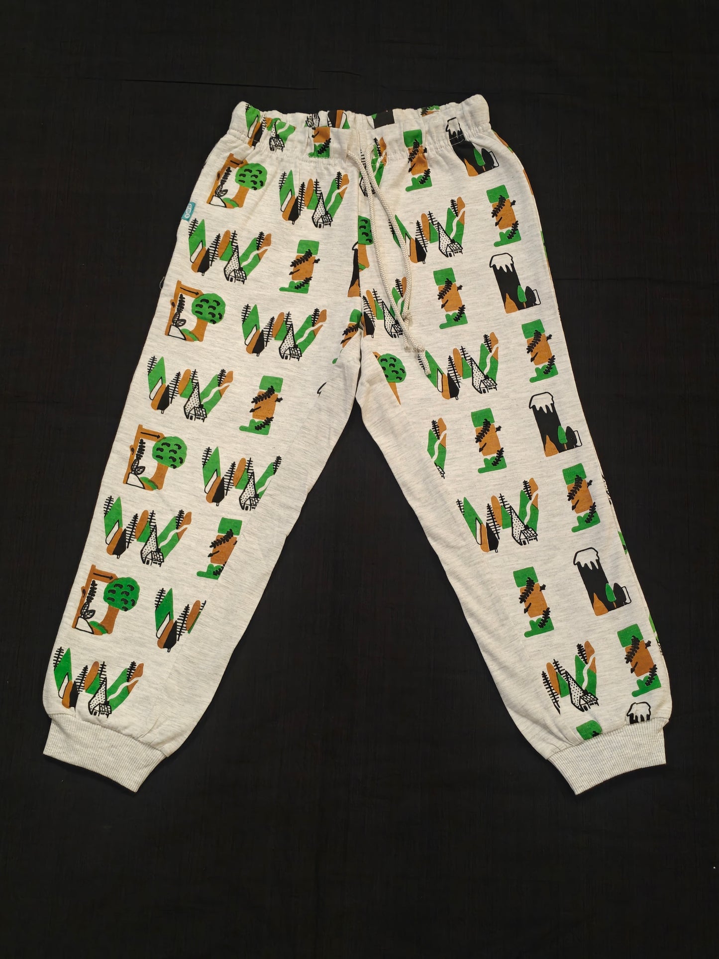 Light grey track pants for kids with forest prints