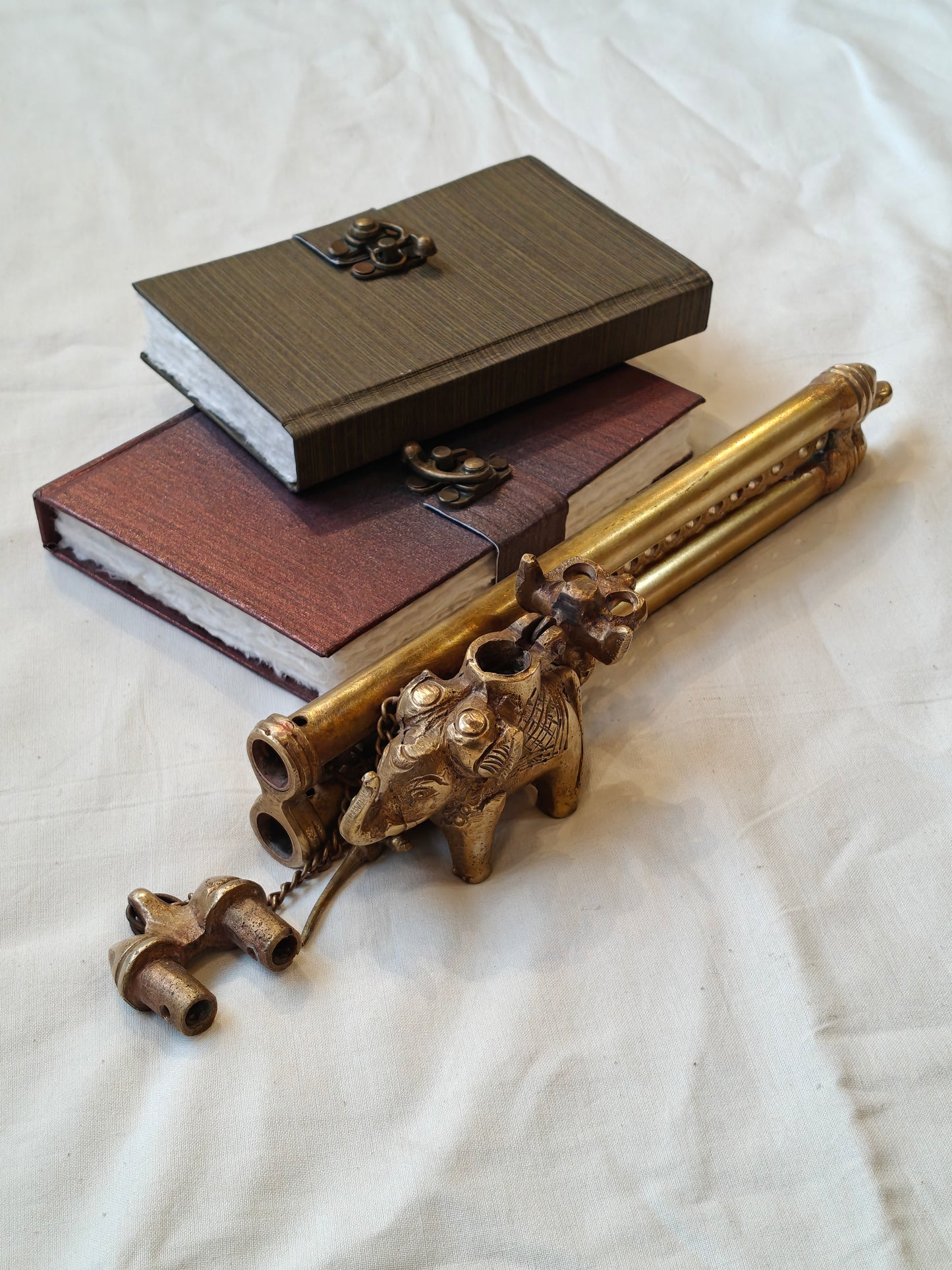 Vintage brass handcrafted ink pot with a person riding on an elephant design, double pen / quill holder with lock