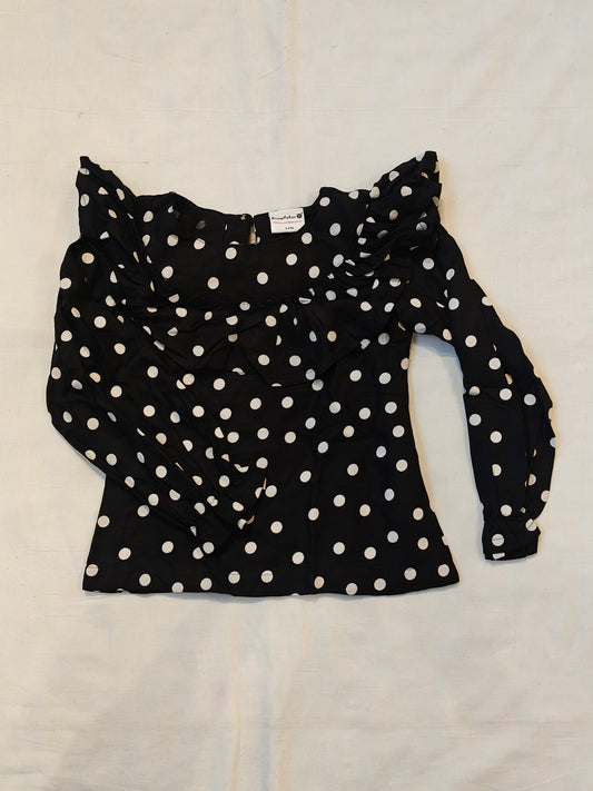 Black with white polka dots top with ruffled neck and sleeves