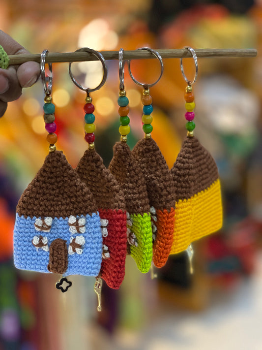 Colourful crochet hut keychain charms