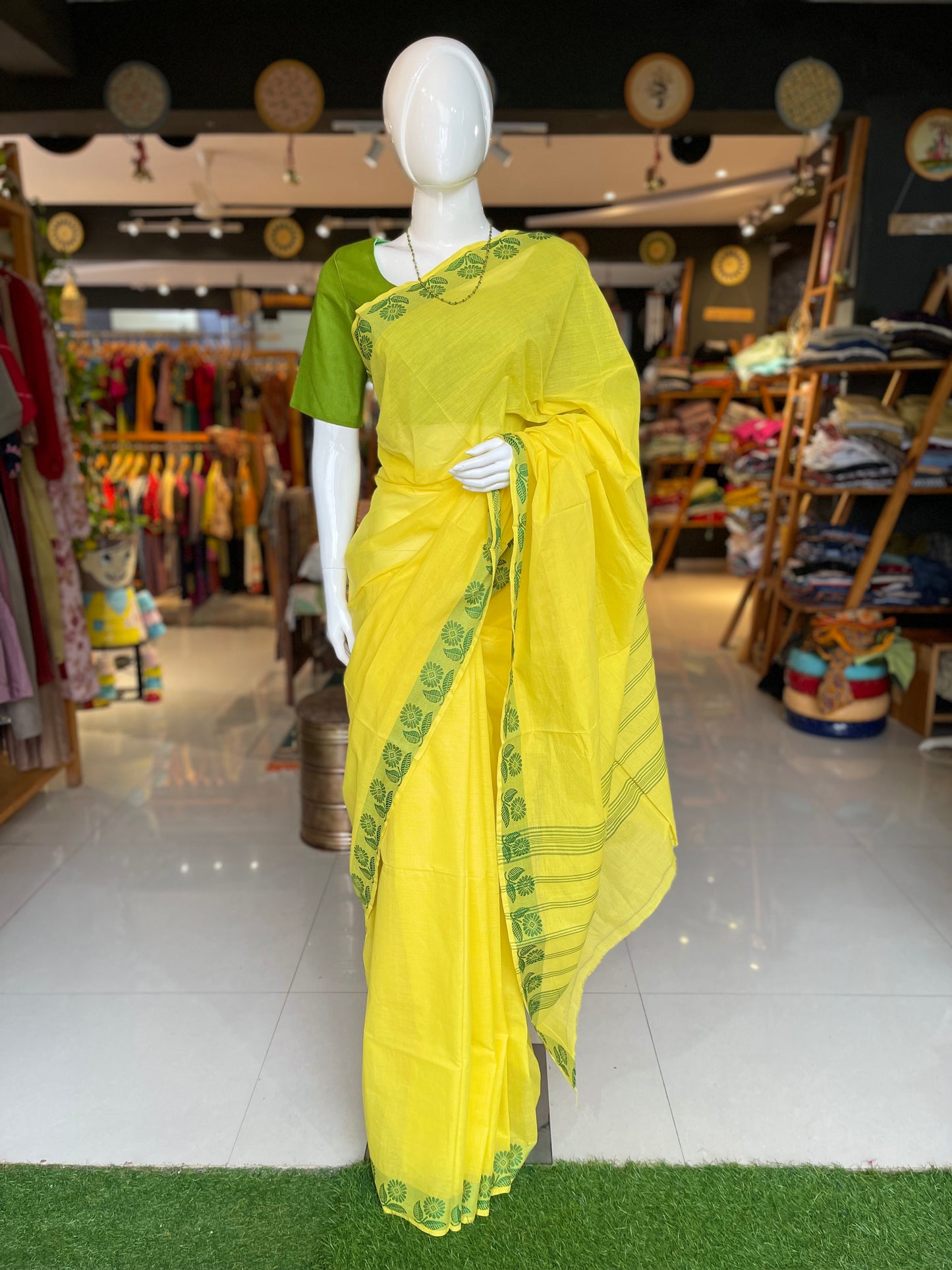 Yellow cotton handloom saree with green floral border