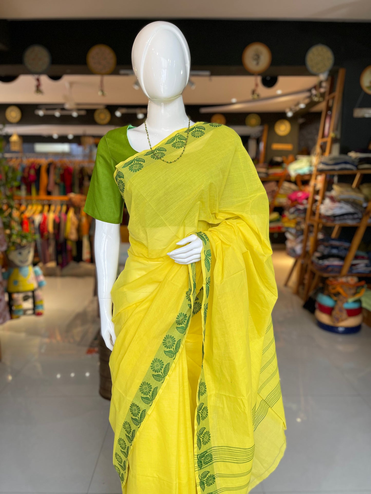 Yellow cotton handloom saree with green floral border