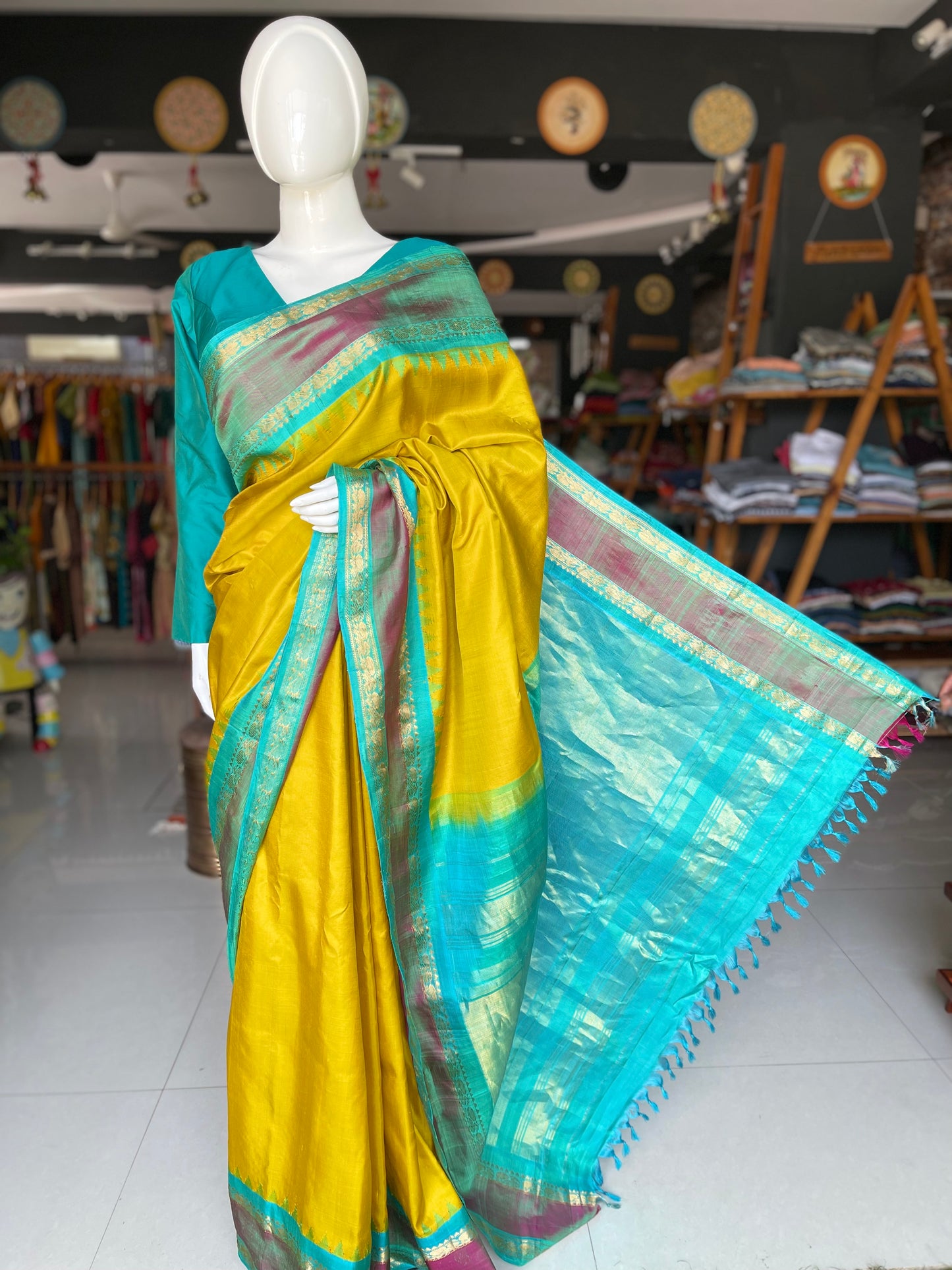 Beautiful mustard and green combination pure silk handwoven Gadwal saree with temple borders