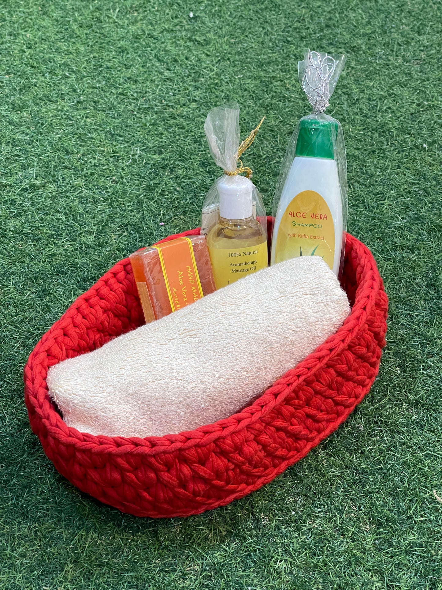 Red oval shaped upcycled knitted cotton basket