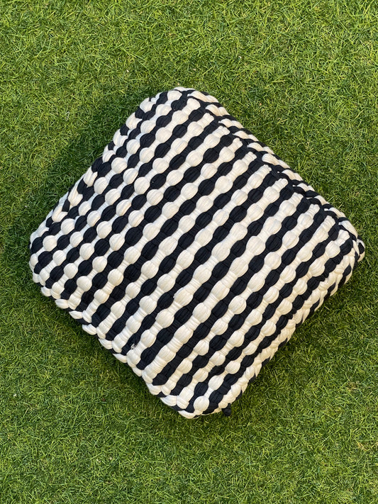 Black and white handwoven upcycled knitted cotton cushion