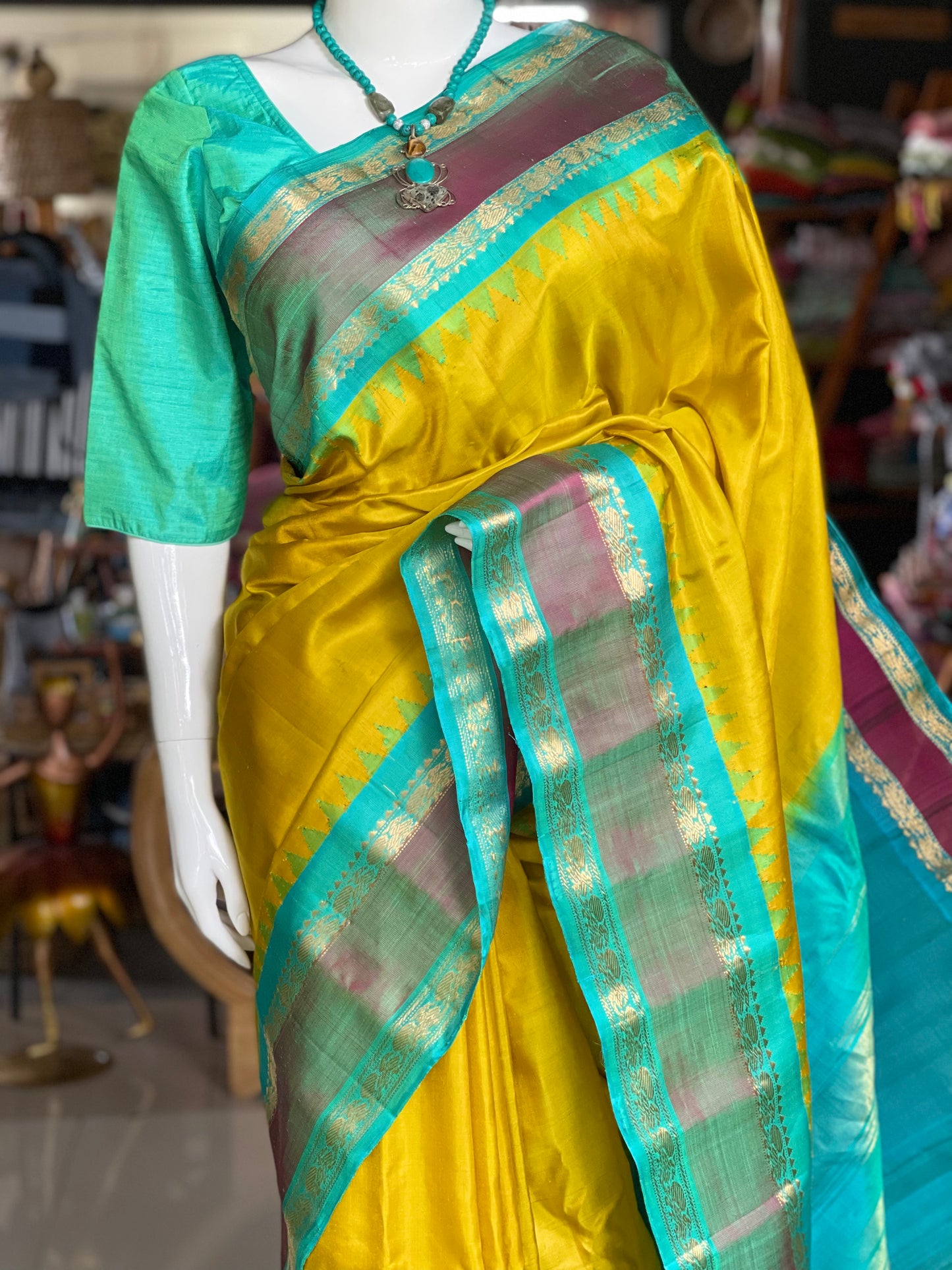 Beautiful mustard and green combination pure silk handwoven Gadwal saree with temple borders