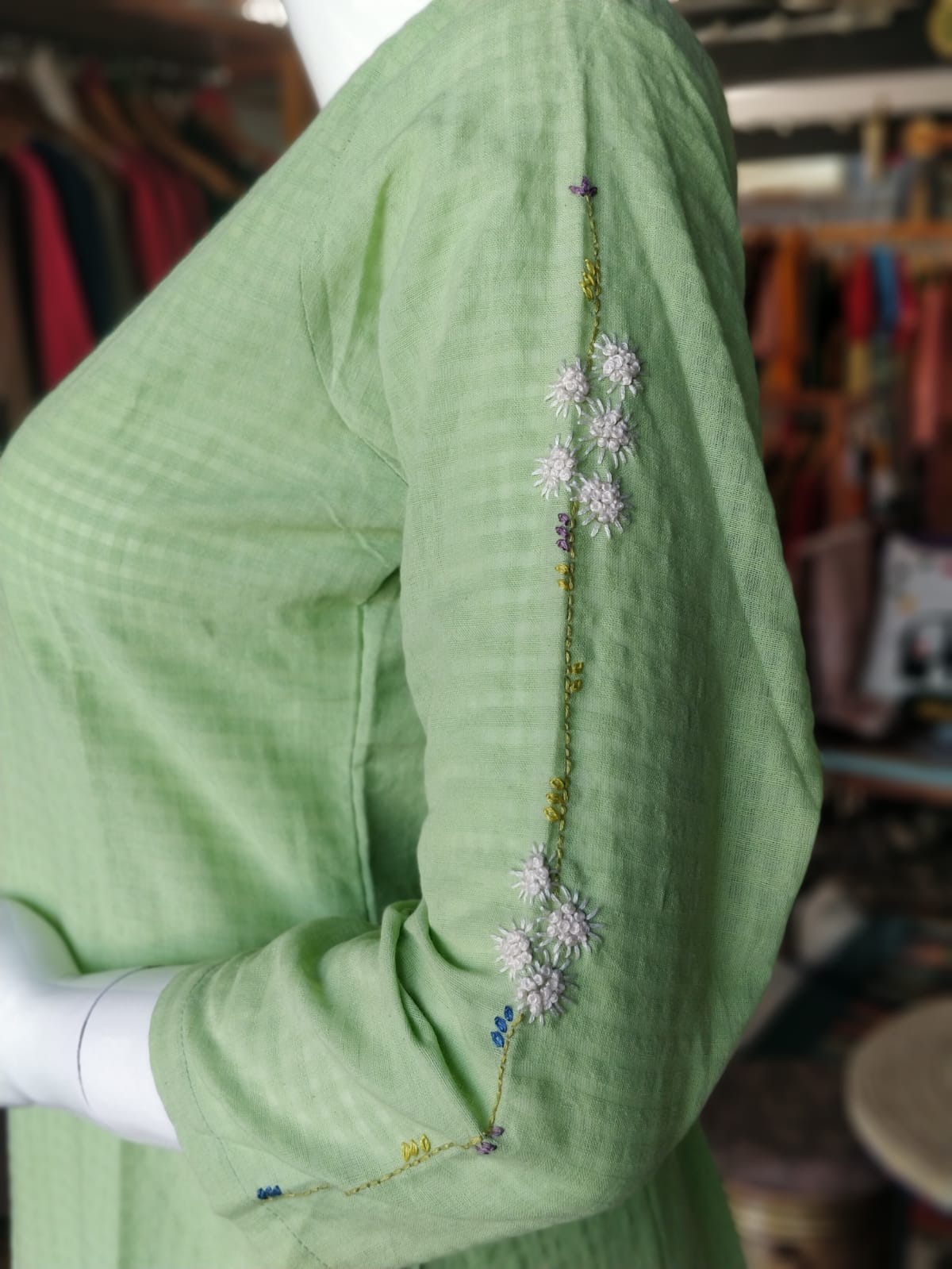 Pastel green cotton straight cotton kurti with floral hand embroidery for neck and sleeves