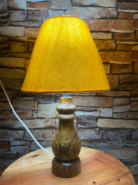 Yellow lamp shade with wooden base